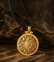 Nine Treasures Compass, yellow gold appearance with black braided cord